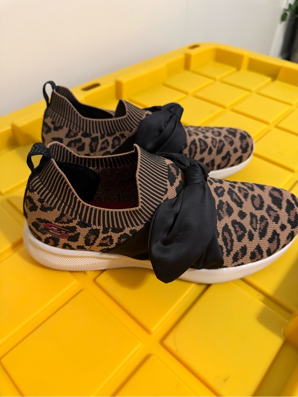 Skechers Leopard Print Slip-On Sneakers with Black Bow